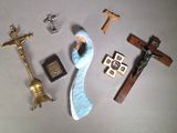 a figurine of a woman holding a cross and a crucifix