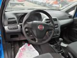 dashboard of a small car with a steering wheel and dashboard controls