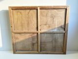 a picture of a wooden window with a glass pane on it