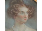 an antique portrait of a woman wearing pearls and a pearl necklace