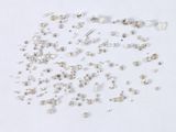 a lot of small white diamonds on a white surface