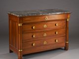an antique chest of drawers with marble top and brass handles