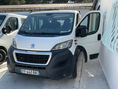 a white van that is parked next to a white van