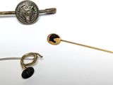 several different types of jewelry are displayed on a white surface