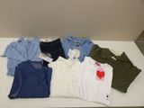 a lot of clothes that are on a table