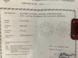 someone is holding up a certificate with a diamond on it
