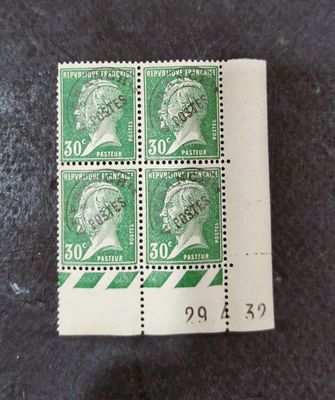 four stamps with a picture of a man ' s head on them