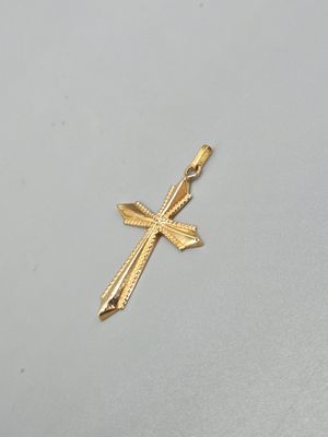 l'image d'une croix en or sur un fond blanc