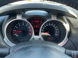 a close up of a car dashboard with a speedometer and gauges