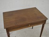 a small wooden table with a drawer underneath it