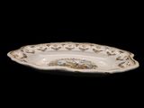 a close up of a plate on a black background