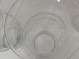 two empty wine glasses sitting on a table