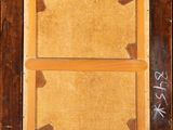 painting of a wooden frame with writing on it in a room
