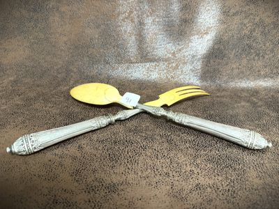 two forks and two spoons on the table
