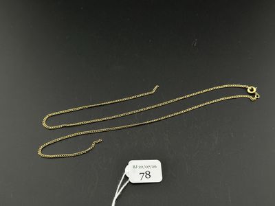 a gold chain with a tag attached to it