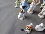 many figurines that are sitting on a table