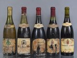 several bottles of wine are lined up on a table
