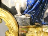 a picture of a painting of a woman sitting on a ledge