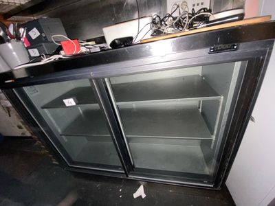 an image of a kitchen with a refrigerator and a counter