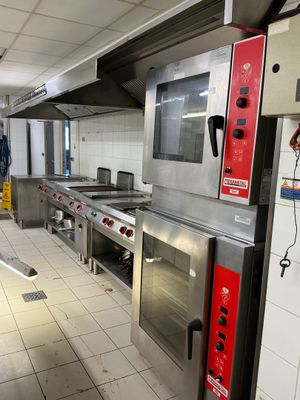 a large kitchen with a lot of appliances in it