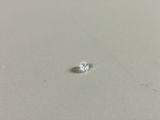 a close up of a single diamond on a white surface