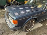 an image of a blue car parked in a garage