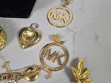 a lot of gold and silver jewelry on a table