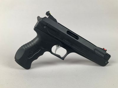 a close up of a gun on a white surface