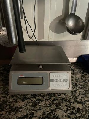 an image of a digital scale on a kitchen counter