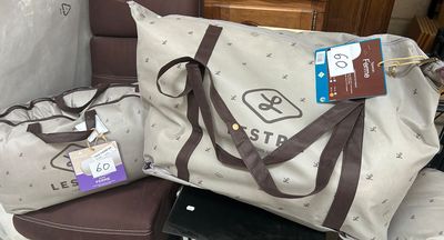 a lot of luggage sitting on the floor next to a chair