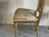 two chairs sitting next to each other in a room