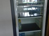 a refrigerator that has a sign on the front of it