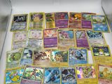 the pokemon cards are in a box on the table