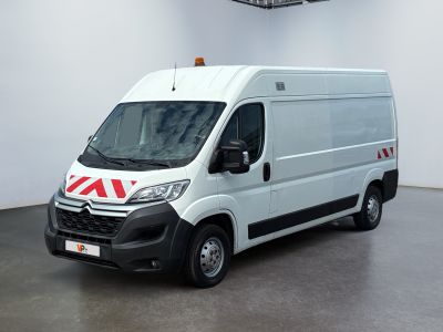 a picture of a white van parked in a room