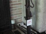 a black iron fire place with a sign on it