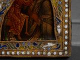 painting of a woman holding a child in her arms in a gold frame