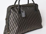 a close up of a brown and black handbag on a white background