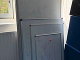 a refrigerator and freezer in the corner of a room