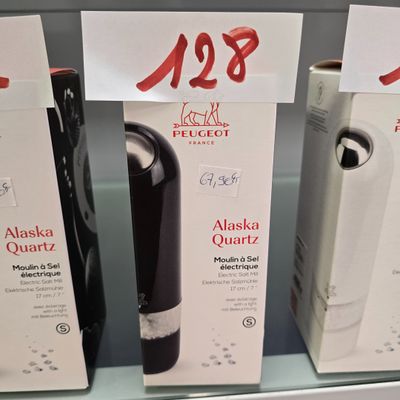 several boxes of wine are on display in a store