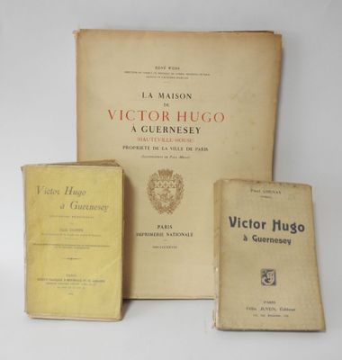 three books are sitting on a table next to each other