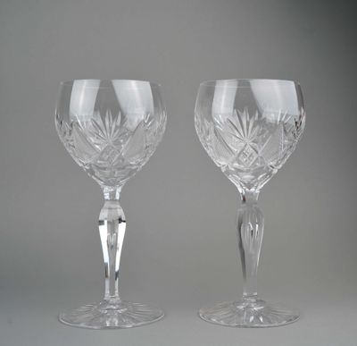 pair of cut crystal goblets on a grey background