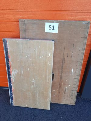 two pieces of wood sitting next to each other on the floor