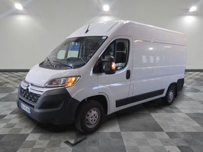 the white van is parked on a checkered tile floor