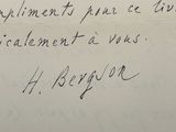 an old handwritten letter from a man who is holding up a piece of paper with writing on it