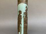 a vase that has a picture of a man and a woman on it