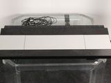 a glass table with a glass top and a black and white tile top