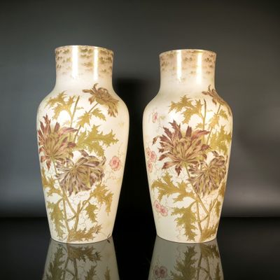 two vases that are sitting on a table