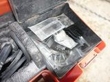 a tool box with tools inside of it on the floor