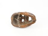 a small piece of wood that has been carved to look like a boat