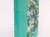 a green book with a picture of a cat on it